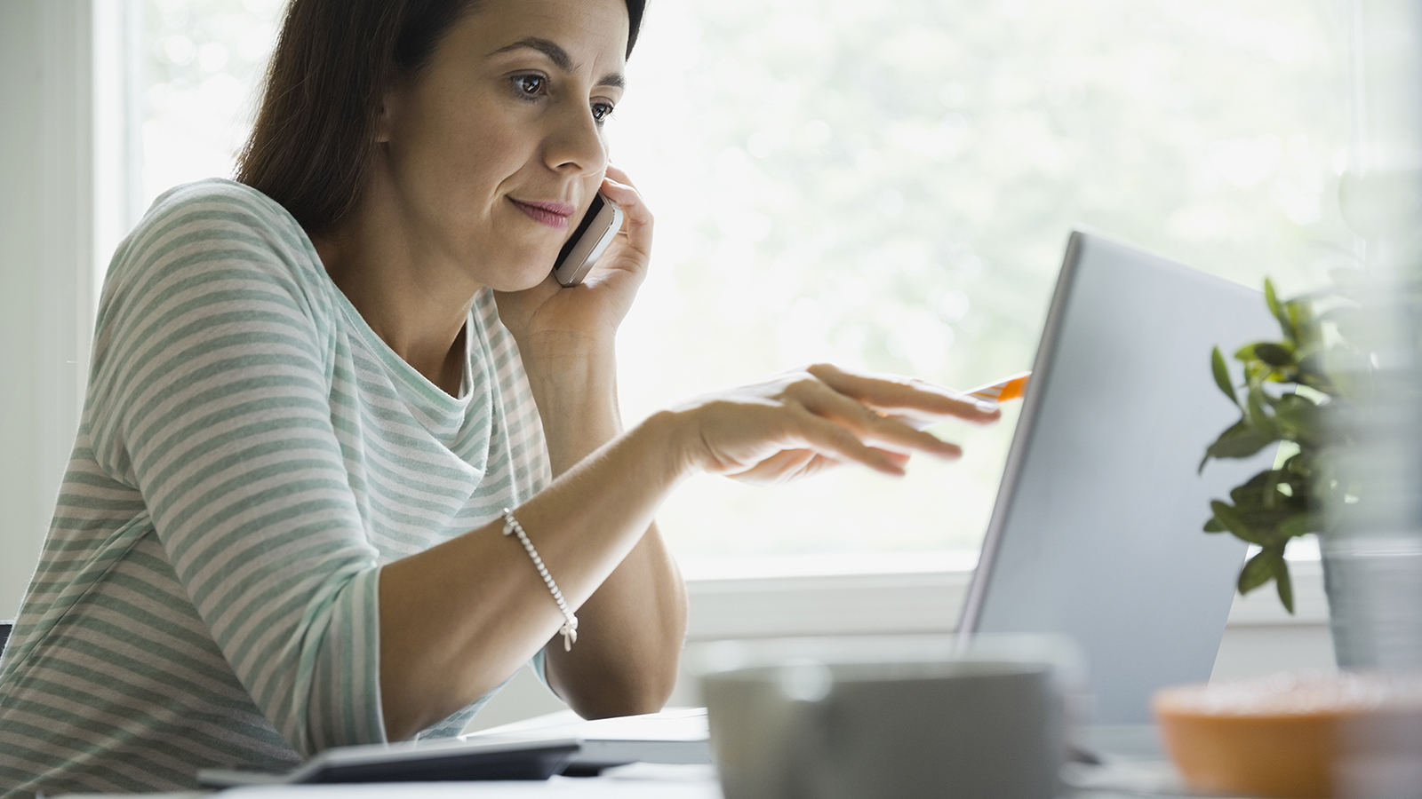 business-woman-laptop-phone-1600x900